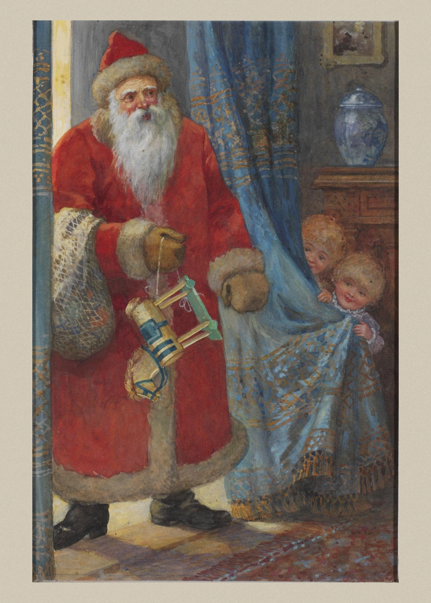Father Christmas in a long red fur-trimmed robe holds a sack of toys while two children peep at him from behind a blue curtain.