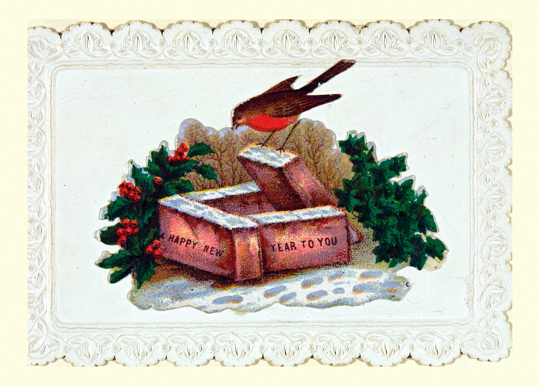 A robin perches on a snow-topped red box inscribed Happy New Year to you, with holly and ivy, inside a white embossed lace-paper border.